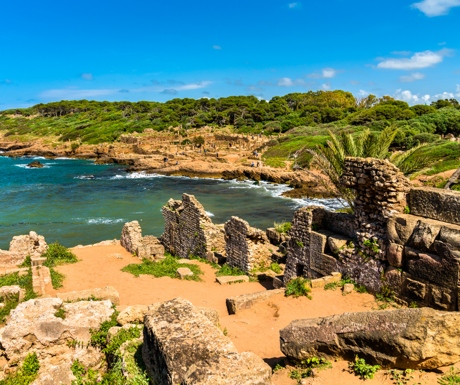 Stone walls of the Roman ruins of Tipasa beside the turquoise Mediterranean