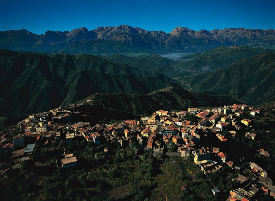 Kabylie hilltop village with the Djurdjura mountains behind