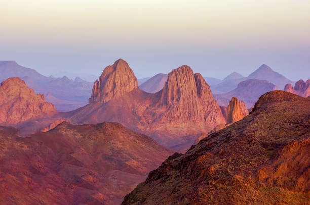 Volcanic peaks of the Hoggar Mountains at sunrise seen from Assekrem