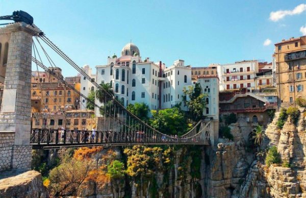 Constantine suspension bridge and a white building above the Rhumel gorge