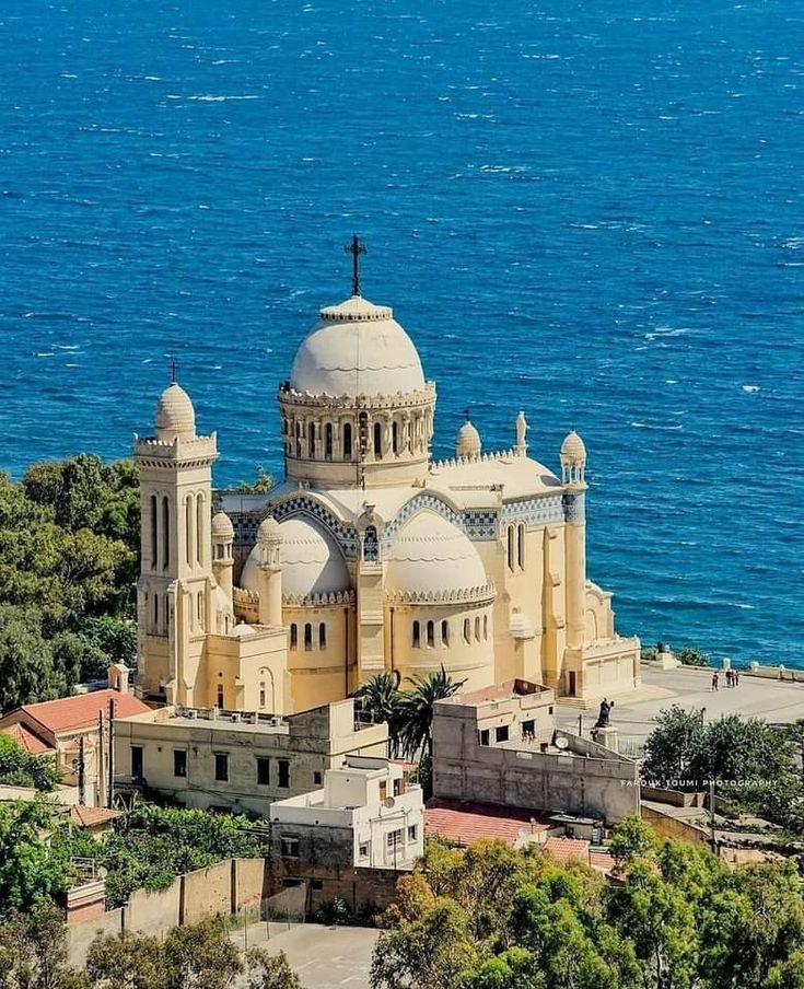 Notre-Dame d'Afrique basilica above the blue Mediterranean in Algiers