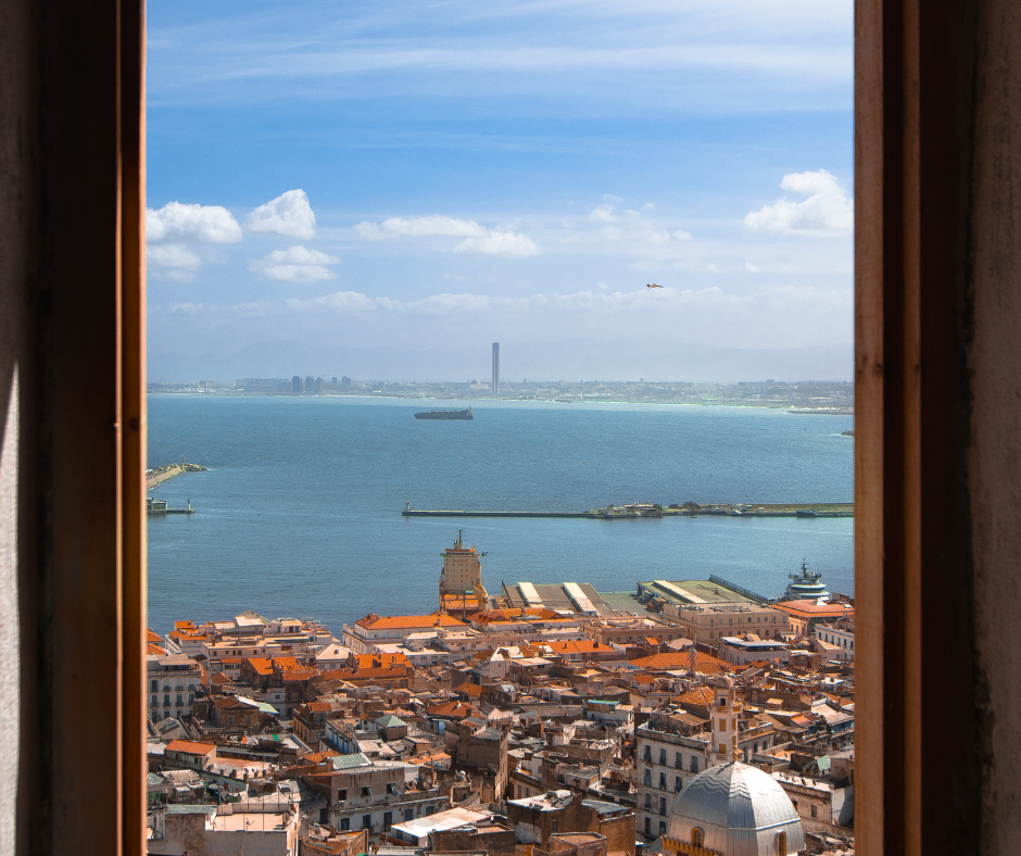 View of the Bay of Algiers and rooftops through a Casbah window