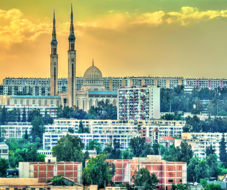 Twin minarets and dome of the Emir Abdelkader Mosque above Constantine apartment blocks