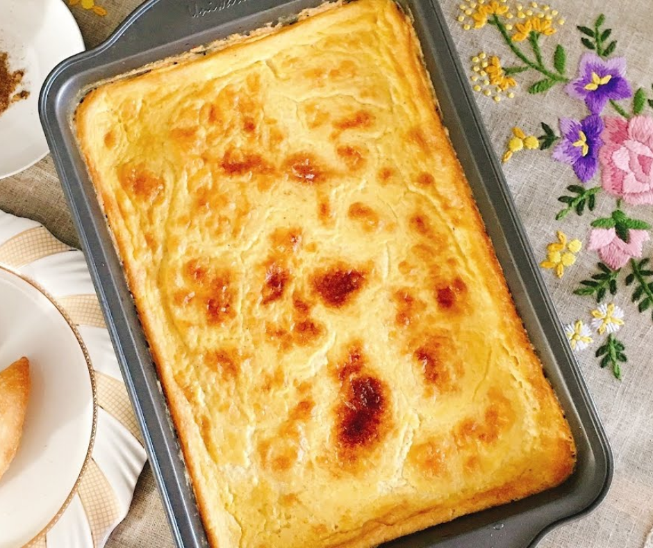 Baked karantika chickpea flan with a golden, lightly browned top in a tray