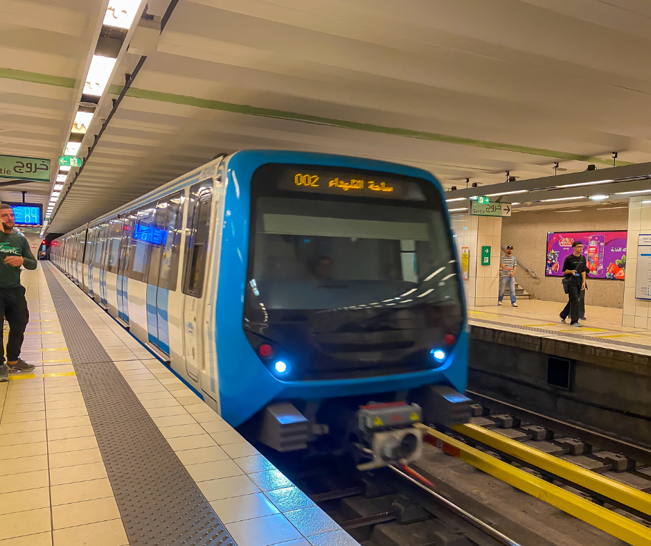 Blue Algiers metro train pulling into an underground station platform