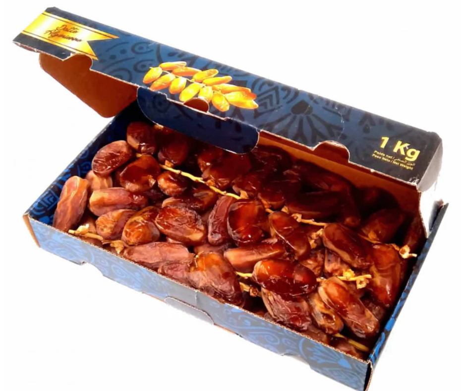 Open box of Deglet Nour dates still on the stalk