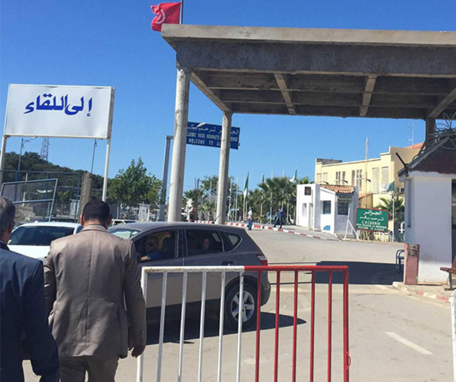 Border post gate with an Arabic sign between Tunisia and Algeria