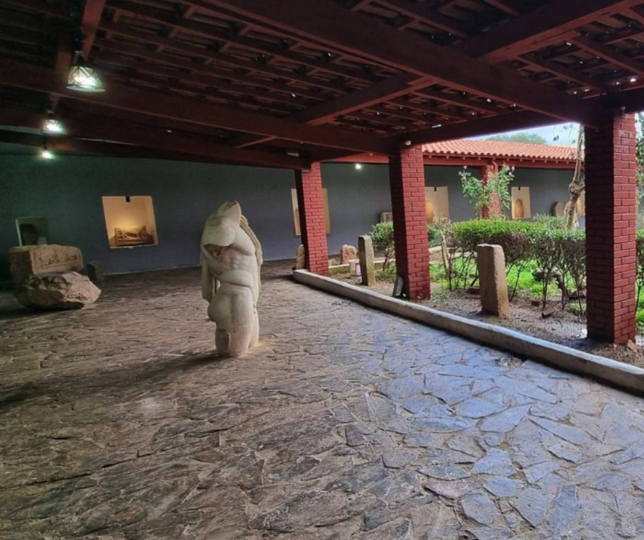 Covered gallery of the Hippo Regius museum with a marble statue