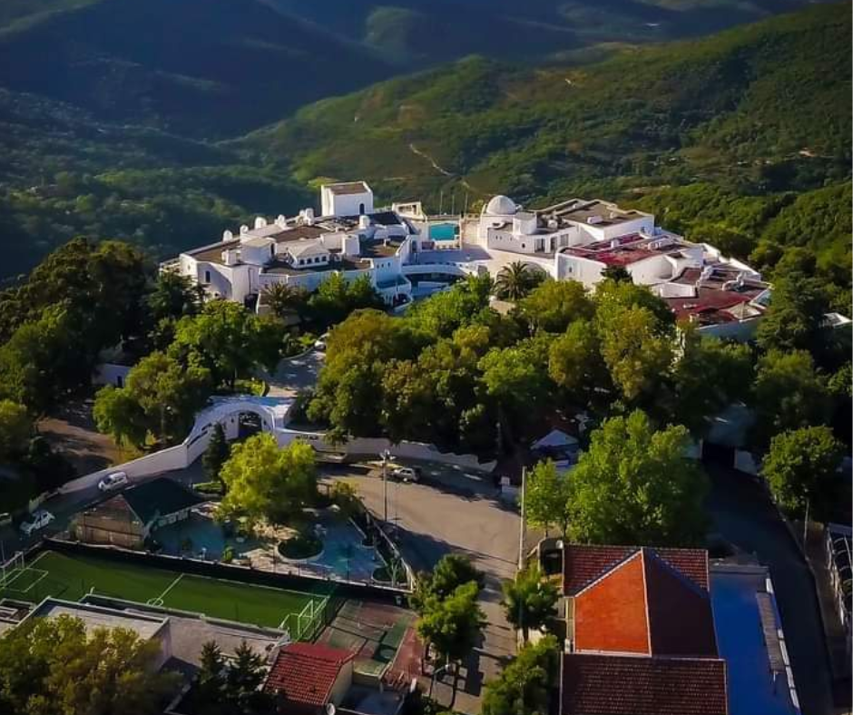 White hotel complex among forested hills at Seraïdi above Annaba