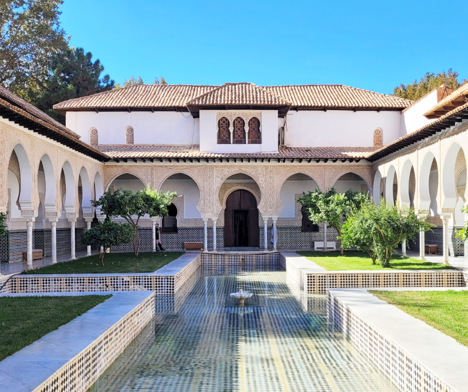 Courtyard of El Mechouar Palace in Tlemcen with a tiled pool and horseshoe arches