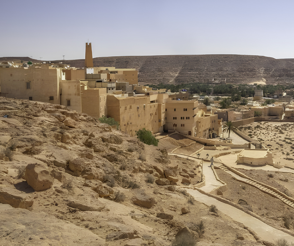 Mud-colored ksar and minaret on a rocky hillside in the M'Zab valley