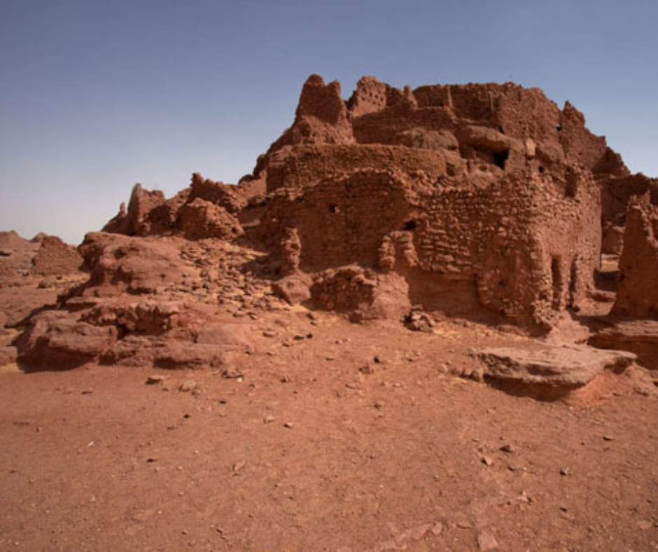 Crumbling red mud-brick walls of the old ksar of Ighzer