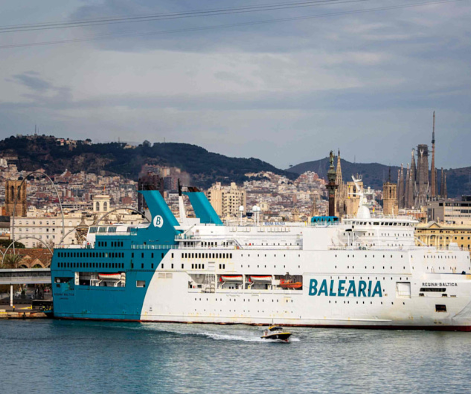Baleària ferry docked in Barcelona with the city and Sagrada Família behind