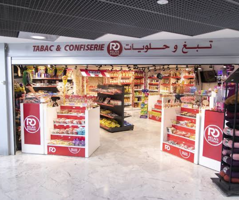 Airport tobacco and sweets shop with Relais d'Oran branding