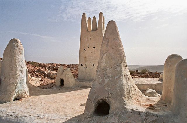 Whitewashed conical tomb monuments in a M'Zab Valley cemetery near Ghardaïa