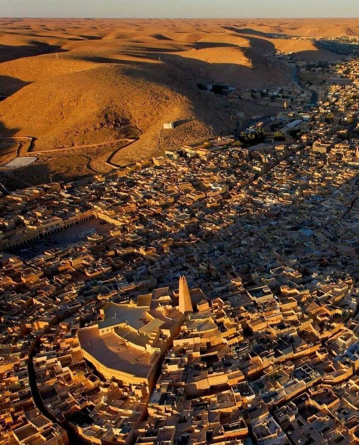 Aerial view of the ksar of Ghardaïa and its mosque minaret in golden light